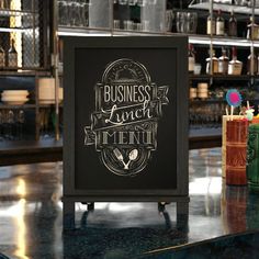 a chalkboard sign sitting on top of a table