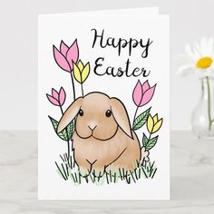 a greeting card with an image of a bunny surrounded by flowers