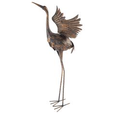 a bronze statue of a crane with its wings spread out and it's head turned to the side