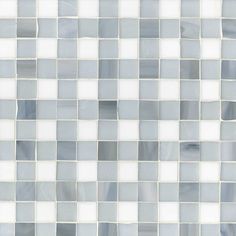 a white and gray tile wall with squares