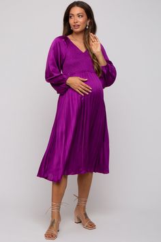 Details A satin maternity midi dress with a v-neckline, a smocked top, long sleeves, and a pleated skirt. Content + Care 100% PolyesterHand Wash Cold, No Bleach, Lay Flat to DryImport Size + Fit Length: 43"Sleeve Length: 17.5"Measured From: SmallUndergarments: May be worn with a Standard BraProduct Code: 89615Model Stats: Height: 5'7"Bust: 32.5"Hips: 36"Wearing Size: Small Dark Purple Dress, Fall Maternity Outfits, Pinkblush Maternity, Dress Modest, Maternity Midi Dress, Fall Maternity, Baby Shower Dresses, Smocked Top, Purple Satin