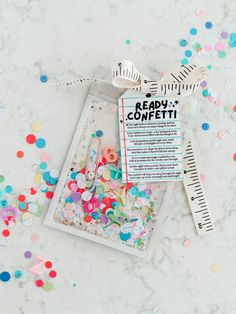 scissors and some confetti on a table