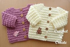 two knitted sweaters with teddy bears on them