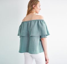 "THALIA off-the-shoulder top is flirty and fun. DETAILS - Elastic neckline - Off the shoulder design - Oeko-Tex certified 100% local washed midweight linen - Cut and sewn to order just for you in our studio COLOR - Dark turquoise, you can also choose other colors above - Fabric samples are available here https://www.etsy.com/listing/586569696/linen-fabric-samples SIZING & FIT - Relaxed, loose fit - Length is approximately 55 cm / 21.5 inches - Measurements taken from a size S - Model is 5'10 Off-shoulder Ruffled Tops For Brunch, Off-shoulder Ruffled Summer Tops, Off-shoulder Ruffled Tops For Summer, Summer Off-shoulder Ruffled Tops, Summer Off-shoulder Ruffled Top With Short Sleeves, Off-shoulder Top With Ruffles For Brunch, Summer Off-shoulder Top With Ruffles And Short Sleeves, Wide Leg Linen Trousers, Ruffle Linen