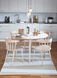 a white table and chairs in a room