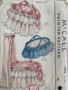 an old sewing pattern for a baby's dress and diaper