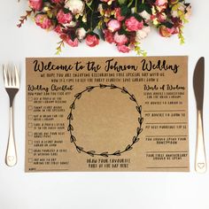 a wedding ceremony program is displayed on a table with flowers and silverware next to it