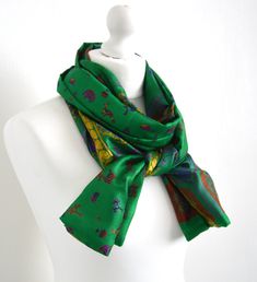 "This scarf has been sewn from a vintage 100% silk sari to make a lovely, simple to wear accessory: just wrap it twice or three times around your neck, or fold in half & slip one end through the other - a versatile accessory of generous proportions. The natural, breathable silk means it will keep you warm in the winter but won't be too hot for the summer. This scarf is available in three styles; a standard straight rectangular scarf, an infinity or loop scarf where the ends are sewn together Vintage Silk Dupatta For Festive Occasions, Festive Vintage Silk Dupatta, Vintage Silk Dupatta For Festivals, Silk Vintage Dupatta For Festivals, Green Silk Bohemian Scarves, Bohemian Green Silk Scarves, Festive Vintage Silk Scarves, Festive Green Bohemian Scarves, Half Slip