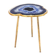 a blue and gold stool with an eye on it's side, against a white background