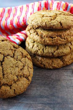 several cookies stacked on top of each other next to a red and white striped cloth