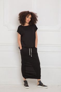 Black Maxi Skirt, Urban Clothing, Women Skirt Maxi cotton jersey skirt with back overlapping asymmetrical detail: |AZUMI| GARMENT FEATURES: *Timeless, a must have piece for every wardrobe *Comfy, soft, easy to wear *Classic maxi pencil silhouette *Elasticated waistband in poplin cotton with drawstring *Overlapping back detail with a dramatic split *Made from quality soft cotton jersey COLOUR OPTIONS: This product also comes in the following colour options: -black; -ecru; -graphite grey; -light g Black Relaxed Fit Skirt With Lining, Black Relaxed Fit Skirt, Black Skirt Maxi, Minimalist Skirt, Loose Black Dress, Goth Skirt, Steampunk Skirt, Black Tunic Tops, Skirt Plus Size