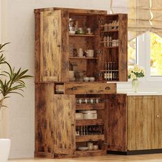 an old wooden cabinet in the middle of a kitchen