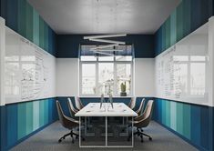 an empty conference room with blue and white walls