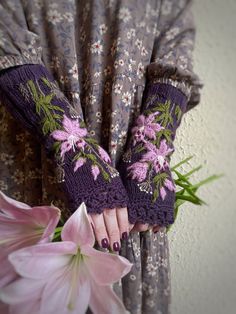 Violet Lily Gloves, Lilies Embroidery Gloves, Hand Embroidered And Knitted Fingerless Gloves, Violet Mittens, Long, Accessories, Gloves & Mittens These unique hand knitted accessory can be a wonderful accent to Your clothes :) Gloves are: length: 25 cm (10 inches); circumference of the wrist: 16.5-18 cm (6.5-7"). fiber composition: 60% wool, 40% acrylic; colors: violet background; pink, ivory, dark purple, green, brown ; size: M. This is my own design. READY TO SHIP I recommend hand washing in l Lilies Embroidery, Embroidery Gloves, Embroidered Gloves, Elven Princess, Knitted Fingerless Gloves, Violet Background, Fingerless Gloves Knitted, Long Gloves, Winter Gloves