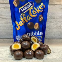 a bag of nibbles next to some chocolate candies