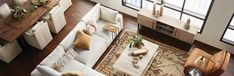 an overhead view of a living room with couches and tables