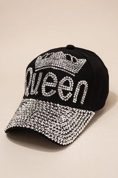 Make way for the Queen! This bling dark denim baseball has rhinestone studs that spell Queen wearing a bedazzled crown. Make a statement and complete your outfit with this regal accessory. The queen hat has bling studs covering the entire bill. Size • Cap is adjustable. One size fits most• Length: 10.5 in (26.67 cm) • Width: 8 in (20.32 cm)• Height: 5.5 in (14 cm) Quality Made from 100% polyesterPlastic Bling Studs Covering the Cap Bill Imported HTC609 Trendy Rhinestone Snapback Baseball Cap, Trendy Snapback Baseball Cap With Rhinestones, Rhinestone Baseball Cap One Size, Rhinestone Embellished One Size Baseball Cap, Black Hats With Round Crown, One Size Fits Most, Queen Hat, Denim Baseball Cap, Pearl Shop, Black Baseball Cap