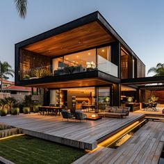 a modern house with wooden decking and outdoor furniture