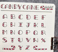 a notebook with candy cane alphabets on it