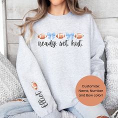 This new custom sweatshirt for our football mamas is perfect for chilly early morning game days!! Comes in so many cute colors, and you can also personalize the sleeve and with whatever you wish! Do not want sleeve personalization? Click here for the sweatshirt with only the front graphic: Here are some more sports shirts in the shop here: https://www.etsy.com/shop/LovelyJaynesBoutique?ref=seller-platform-mcnav§ion_id=33580348 Not finding what you're looking for? Check out more items in the shop Customizable Fall Sweatshirt With School Spirit, Customizable Varsity Sweatshirt For Fall, Customizable Sports Fan Sweatshirt For Game Day, Sporty Fall Tops, Customizable Team Spirit Sweatshirt For Winter, Customizable Sporty Sweatshirt For Fall, Customizable Tops For School Spirit In Fall, Customizable Long Sleeve Cheerleading Sweatshirt, Customizable Long Sleeve Sweatshirt For Game Day