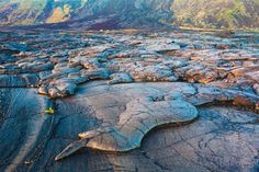 an aerial view of some rocks in the middle of a mountain range with mountains in the background