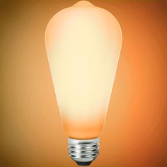 an orange light bulb on a brown background