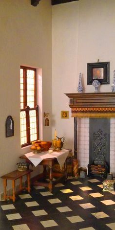 a living room filled with furniture and a fire place