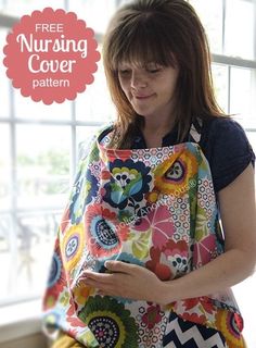 a woman is holding a colorful nursing bag