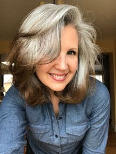 Joni's grey hair transition started when she was in her 50s, and tired of dyeing. She went grey cold turkey with long hair and looks fabulous! She explains why she chose to go grey cold turkey and keep her hair long, and her favorite grey hair products. It's a must-read gray hair transition story! #greyhair #grayhair #goinggray #over50beauty How To Let My Gray Hair Grow Out, Reversing Grey Hair Naturally, How To Tame Wiry Gray Hair, Grey Hair Reversal, Grey Hair Turning Yellow, Brown Hair With Pink Highlights, Dusty Pink Hair, Pastel Pink Hair Color