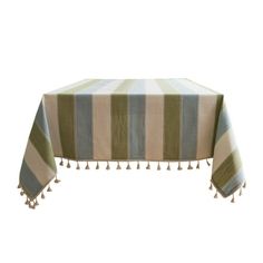 a striped tablecloth with tassels on the edge and fringed edges, set against a white background