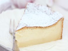 a piece of cheesecake with powdered sugar on top