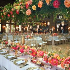 the tables are set with flowers and place settings