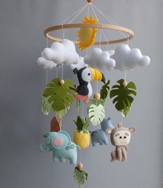 a mobile with animals and plants hanging from it