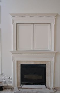 the fireplace is being built with white paint