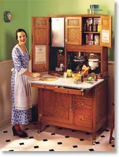 a woman standing in front of a kitchen counter