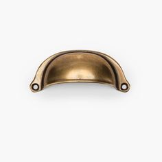 an antique brass cabinet door handle on a white background with clipping for text or image