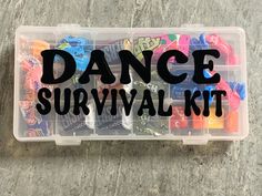 a plastic container filled with assorted candies and the words dance survival written on it