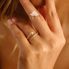 14K Gold Snake Ring, Open Snake Ring, Serpent Band Ring, Snake Head Tail Ring, Stacking Gold Ring, Wrap Around Snake Ring, Cuff Ring Features *Material: 14K Real Gold *Color Options: Yellow Gold, White Gold, Rose Gold *Metal Stamp: 14K (585) *Available Ring Sizes: 3 US to 10 US Size *Weight(approx) : 2.10 grams *Ready to Ship in 3-5 Business Days. FREE Express worldwide shipping. FREE Engraving service Each item is made to order. Comes in a Gift Box with 14K Gold Certificate. This product is 100 Wrap Around Snake, Ring Wrap, Gold Certificate, Snake Head, Fine Jewelery, Cuff Ring, Ring Stacking, Gold Ring Stack, Cuff Rings