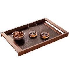 the tray has three glasses on it