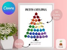 a christmas tree poster with the names and numbers on it next to a potted plant