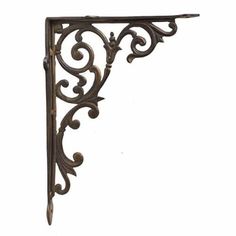 an ornate iron shelf bracket on a white background