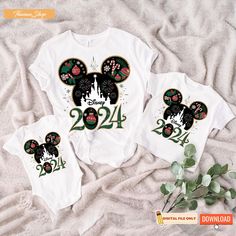 two shirts with mickey mouse ears and numbers on them, sitting next to each other