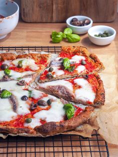 a pizza sitting on top of a cooling rack