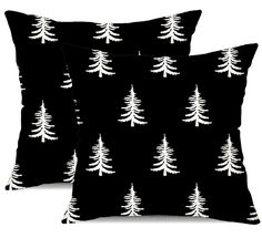 two black pillows with white trees on them