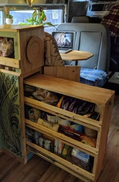 the inside of a vehicle with shelves and drawers