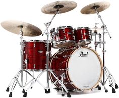 a red drum set sitting on top of a white background