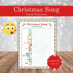 the christmas song printable is shown on a wooden table with lights in the background