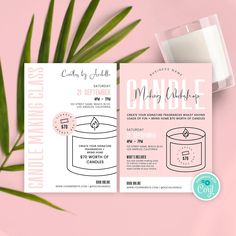 a pink and white wedding card with a candle on it next to a palm leaf