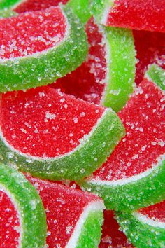 a close up view of watermelon slices covered in sugar