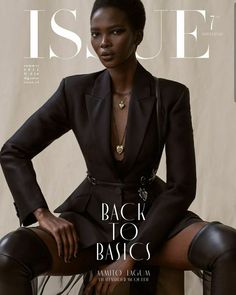 a woman sitting on top of a chair in front of a white wall with the words issue back to basics